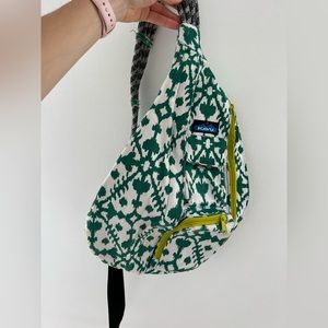 Green and white Kavu backpack